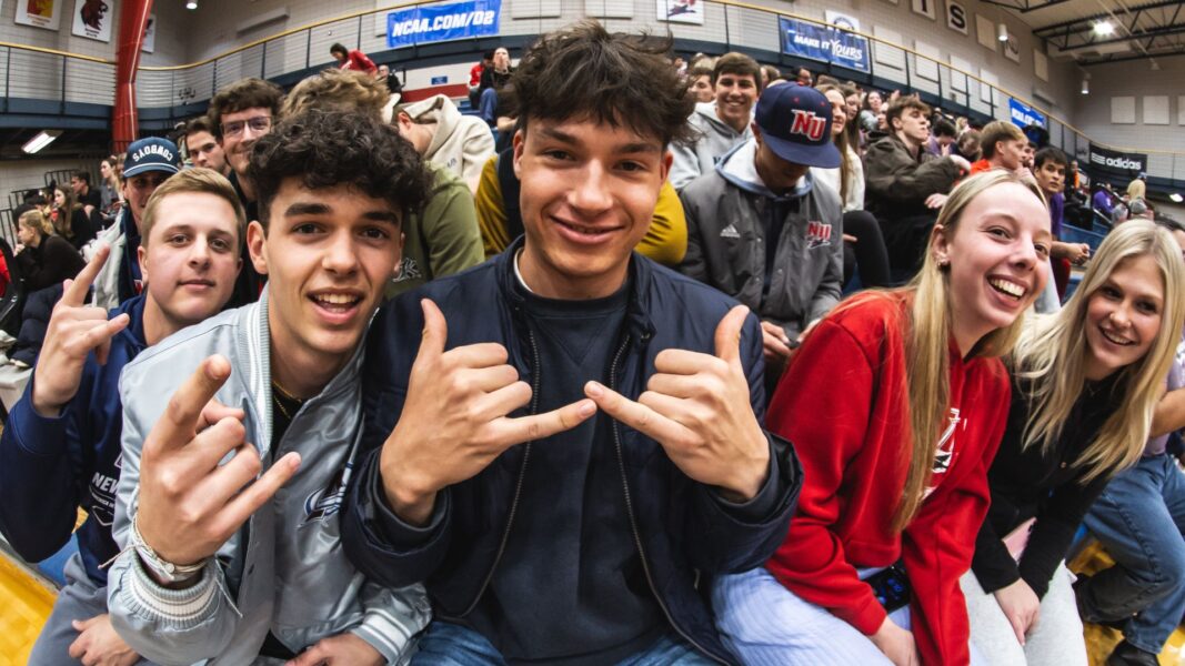 Students smile from the student section.