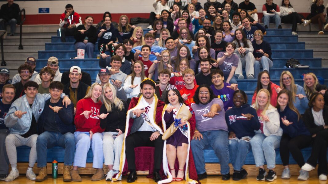 Cordova and Fuentes (front center) with the student section of the stands