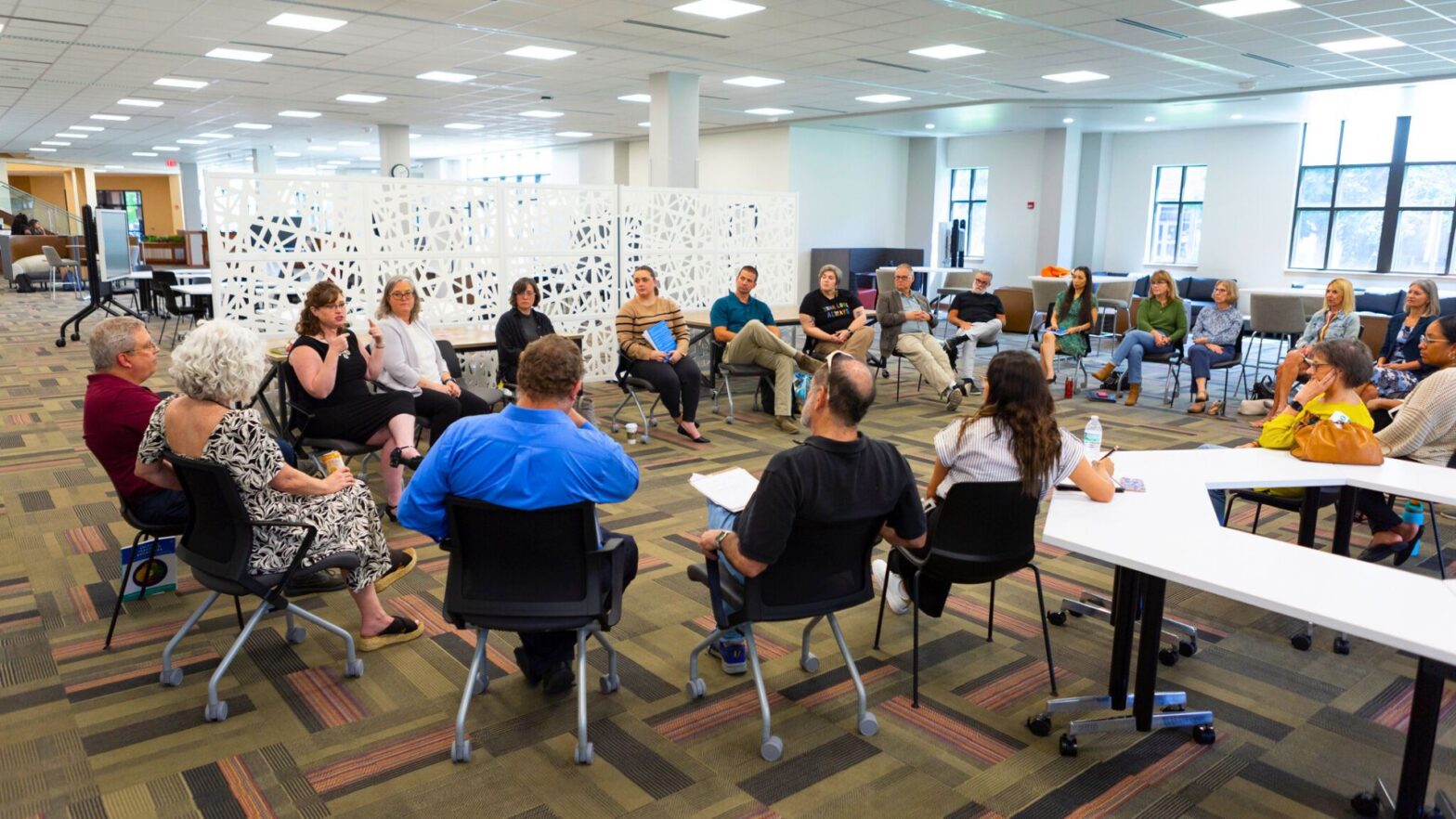 Newman University faculty members gather in the Center for Teaching and Learning in the Dugan Library.