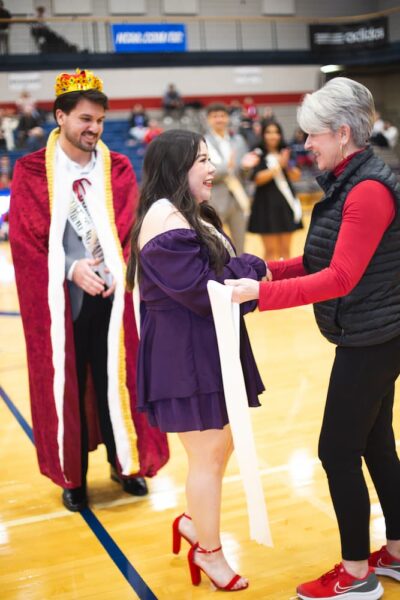 Fuentes is greeted by Dean of Students Andi Giesen.