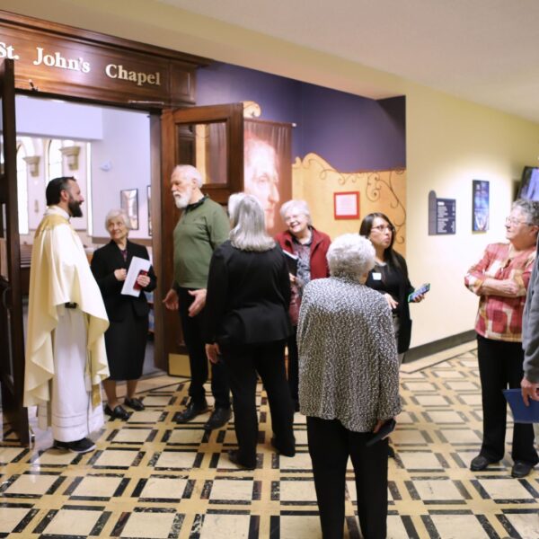 Guests gather outside St. John's Chapel after Mass to celebrate ASC Foundation Day.