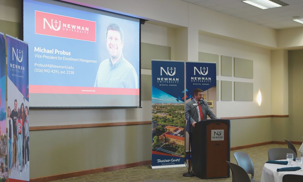 Newman University Vice President for Enrollment Management Michael Probus speaking to Special Scholarship Day guests.