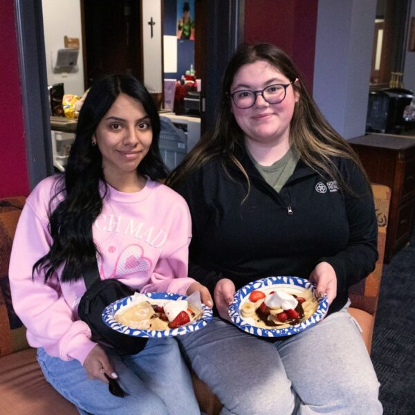 Students enjoy strawberry and chocolate crepes on Crepe Day.