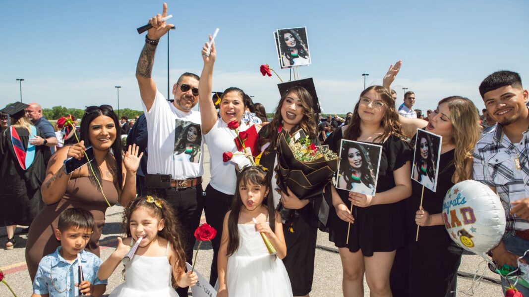 A 2025 Newman University graduate and her family celebrate outside Park City Arena.