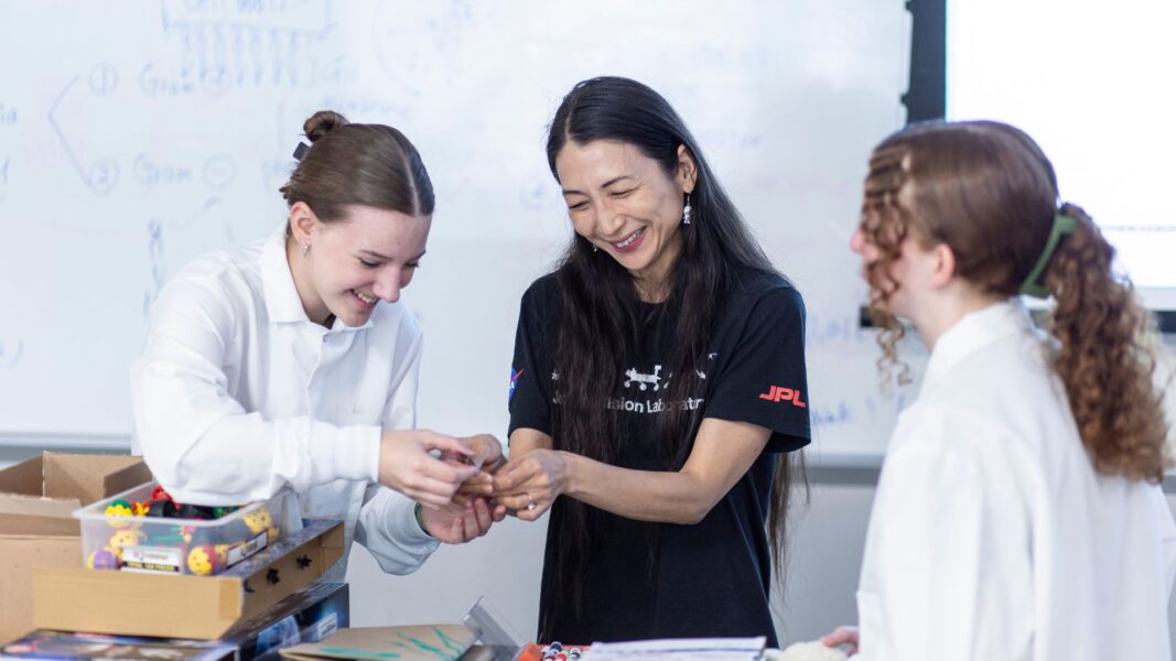Professor Bell smiles as she works with ISSP students.