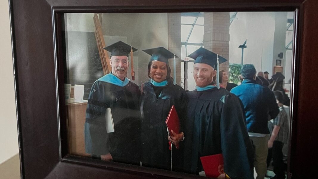 Bernie (center) alongside fellow Newman University graduates in 2012