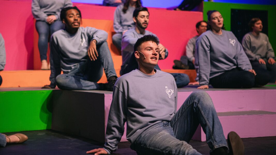 Isaac sings in the Family Reunion Spring Musical.