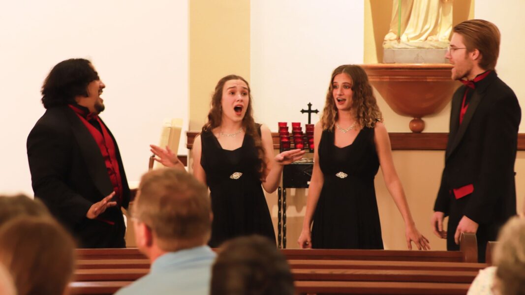 Erika (second from the right) sings during a fall concert in St. John's Chapel.