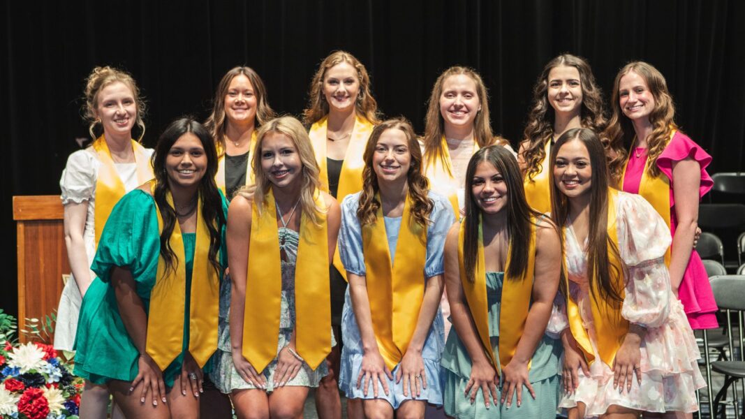 Erika (back row, far right) and fellow graduates of Newman's diagnostic medical sonography program.