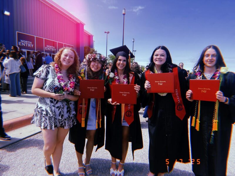 Takeuchi (second from left) alongside fellow bowling teammates on Newman University's commencement day.