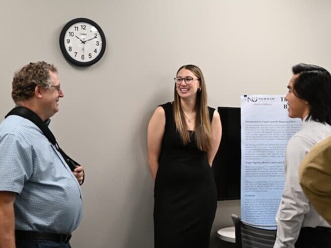 Meyer presents during Scholars Day at Newman.