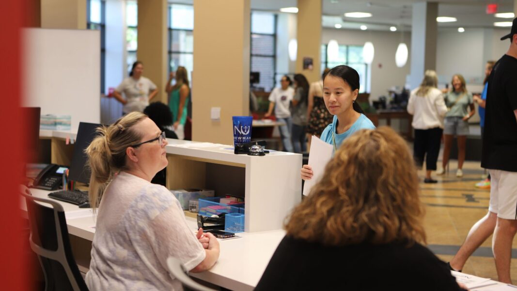 A student checks in at the Student Success Center during orientation weekend.