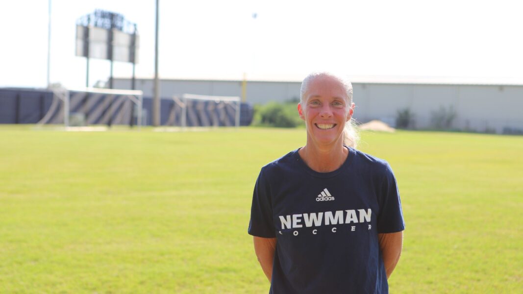 Wylie proudly wears her Newman soccer shirt on the practice field at Newman University.
