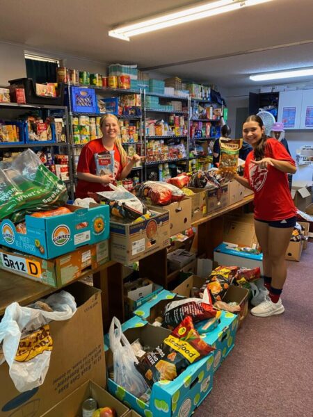 Women's soccer team volunteers at Shepherd's Heart Food Pantry.