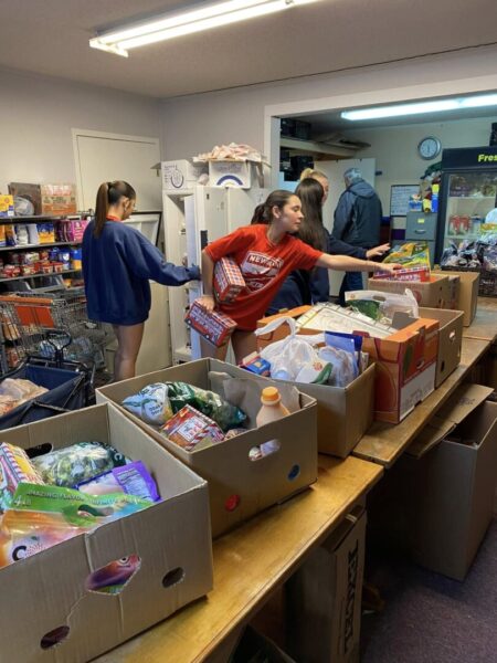 Women's soccer team volunteers at Shepherd's Heart Food Pantry.