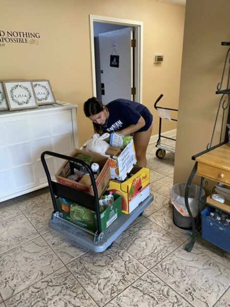 Gallery: Women's soccer team volunteers at Shepherd's Heart Food Pantry.