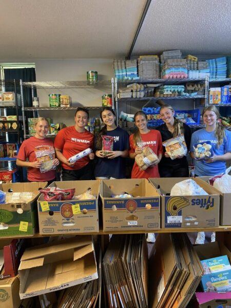 Women's soccer team volunteers at Shepherd's Heart Food Pantry.