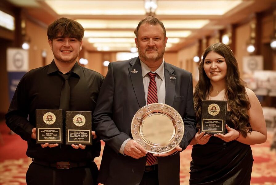 Newman bowling coach Billy Murphy, Center, with athletes Ashley Soto and Liam Hardman