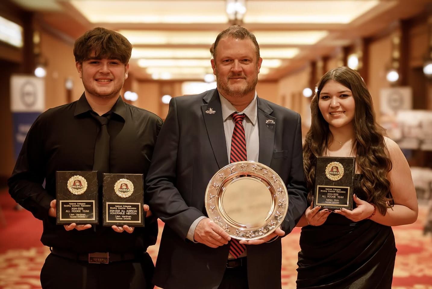 Newman bowling coach Billy Murphy, Center, with athletes Ashley Soto and Liam Hardman