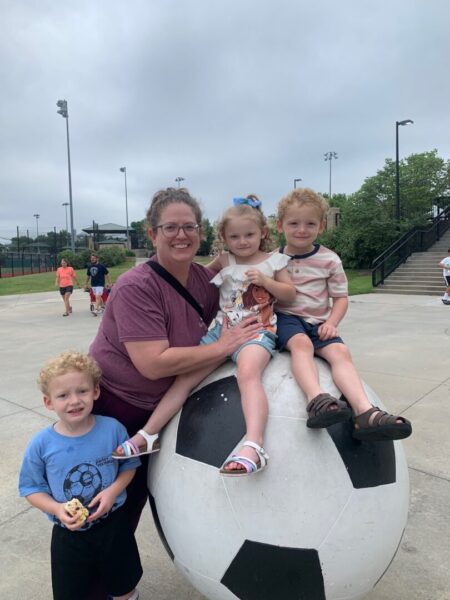 Tyrell with her three grandchildren following a soccer game
