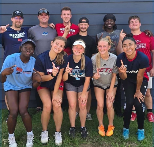 Newman students, both past and present, helped with the summer softball tournament.