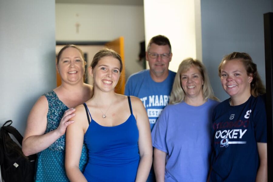 Danielle (far right), mother, Linda (second from right), and father, Jeff, (third from right) get to know roommate Emalee King (second from the left) and her family during move-in day.