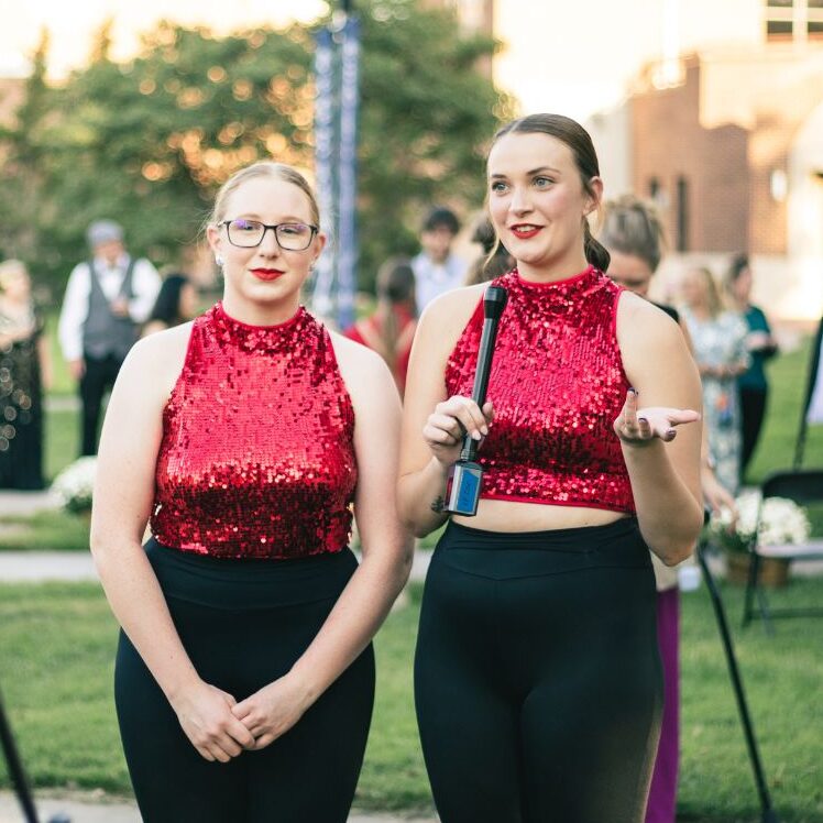 (From left to right) Real and fellow cheer teammate Hailey Mayer