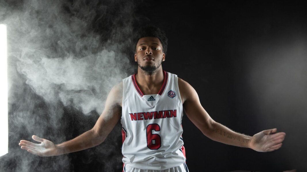 Glenn-Hawkins, arms outstretched, during a photoshoot at Newman University