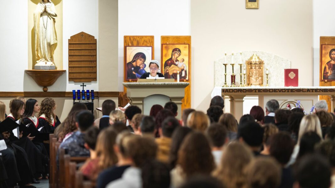 Student Eliana Gaytan reads one of the readings during the Mass of the Holy Spirit.
