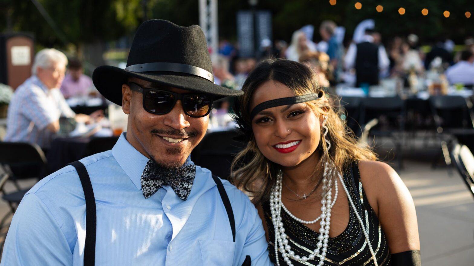 Guests dressed in 1920's attire for the 2024 Party on the Plaza fundraiser.