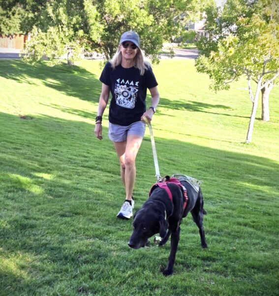 Parish enjoys a walk with one of her canine clients.