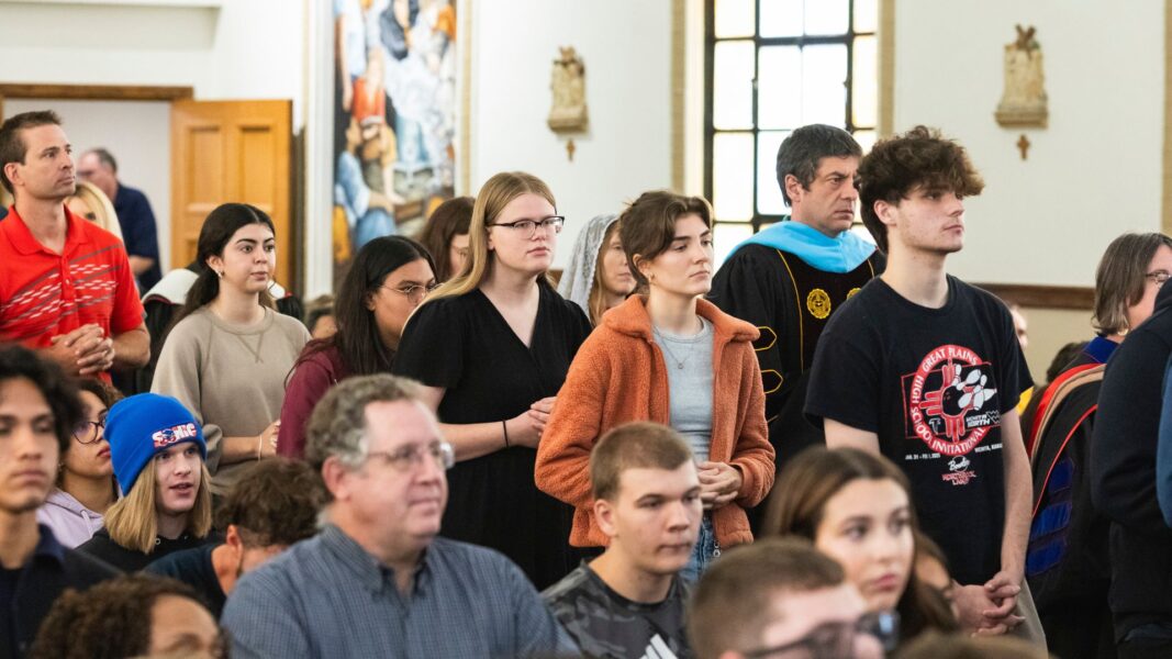 Students, staff and faculty fill the communion line.