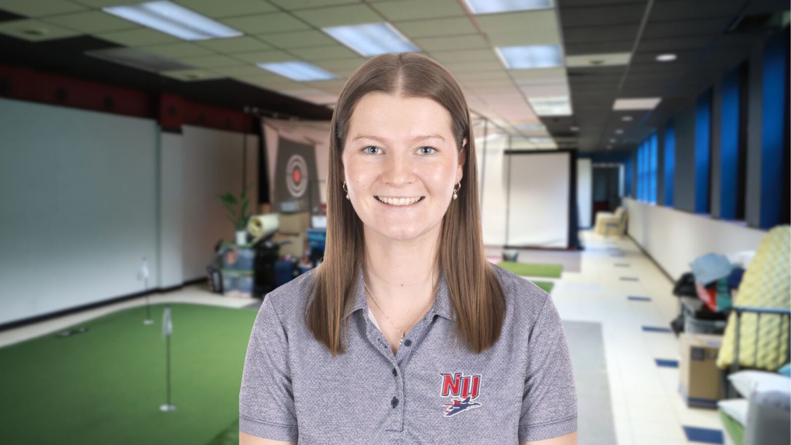Griffiths in the golf practice room at Newman University