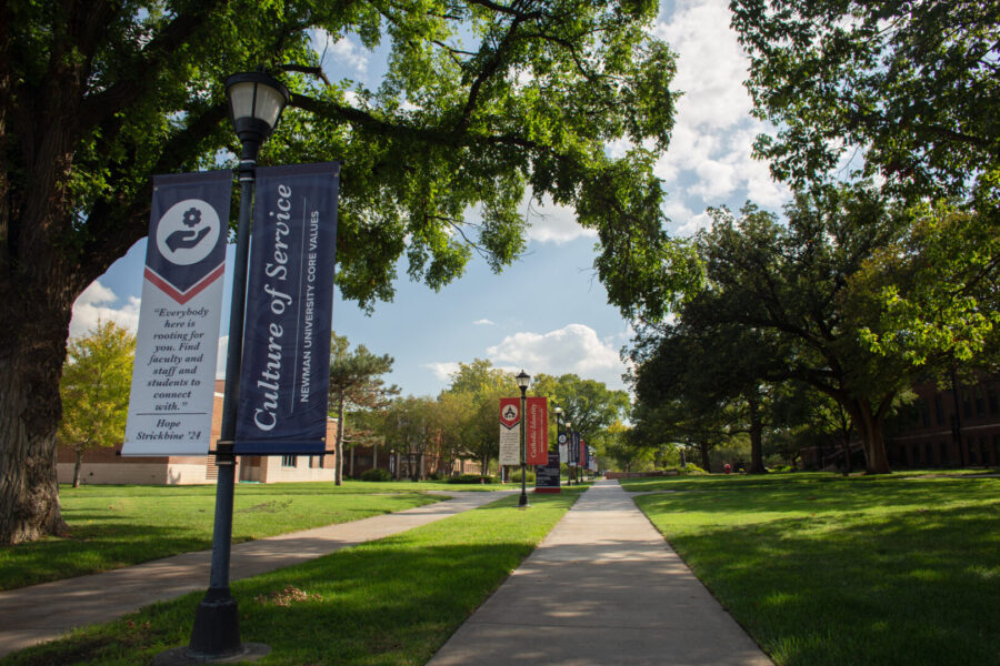 Pictures Newman campus sidewalk with banners
