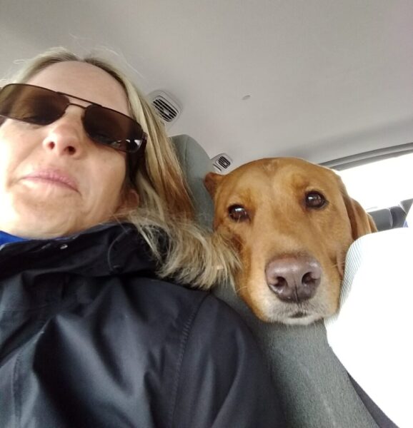 Parish takes a selfie with one of her furry friends.