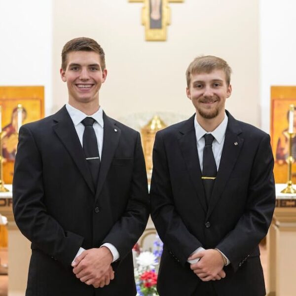 (From left to right) Gus Hanson and Ethan Weiner of the Catholic Diocese of Salina in St. John's Chapel at Newman