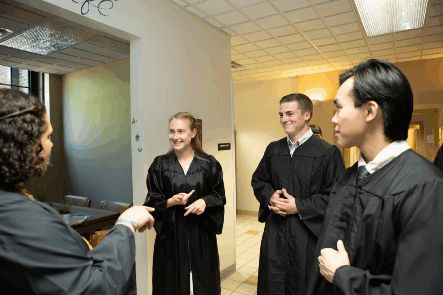 Koenig mingles with fellow graduates before the 2025 Baccalaureate Mass,