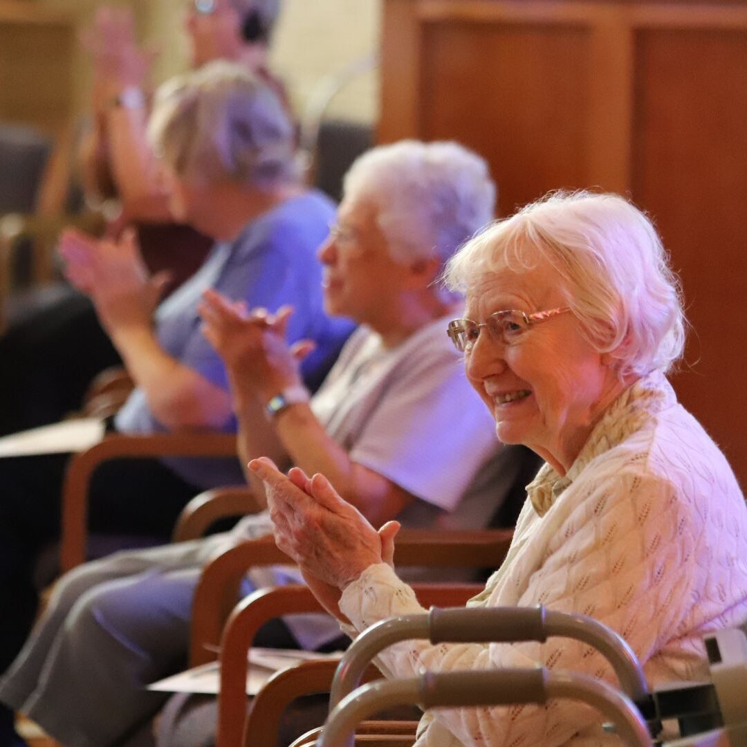 ASC sisters applaud as new ASC Associates are inducted into the program.