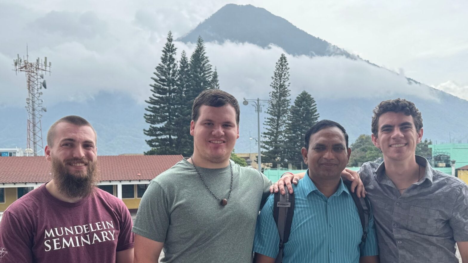 (From left to right) Seminarians Conrad Sissell and Dominic Jirak with Rev. Bob Pinninti and Elliott in Santiago Atitlán.