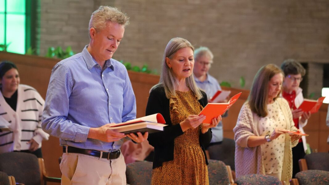 Bontrager (right) sings with her husband, Michael, during the ceremony.