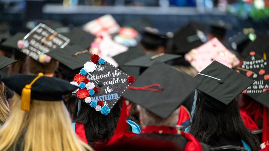 A 2025 graduation cap reads "She believed she could so she mastered it."