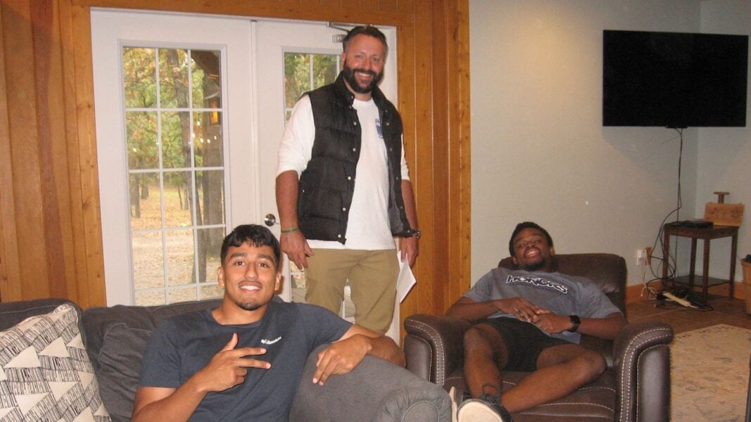 Herzog with Newman students