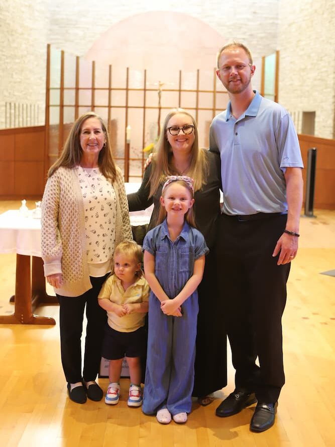 Drewes (center) and her family in the Wichita ASC Center’s Chapel of the New Covenant. 