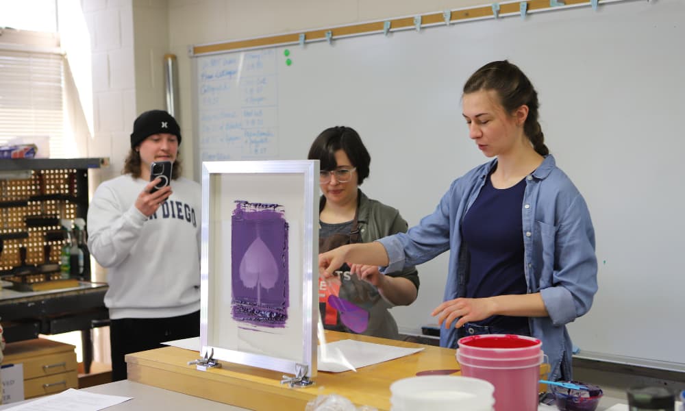 Bachelor-of-Arts-in-Digital Design Professor Emily Ritter with students