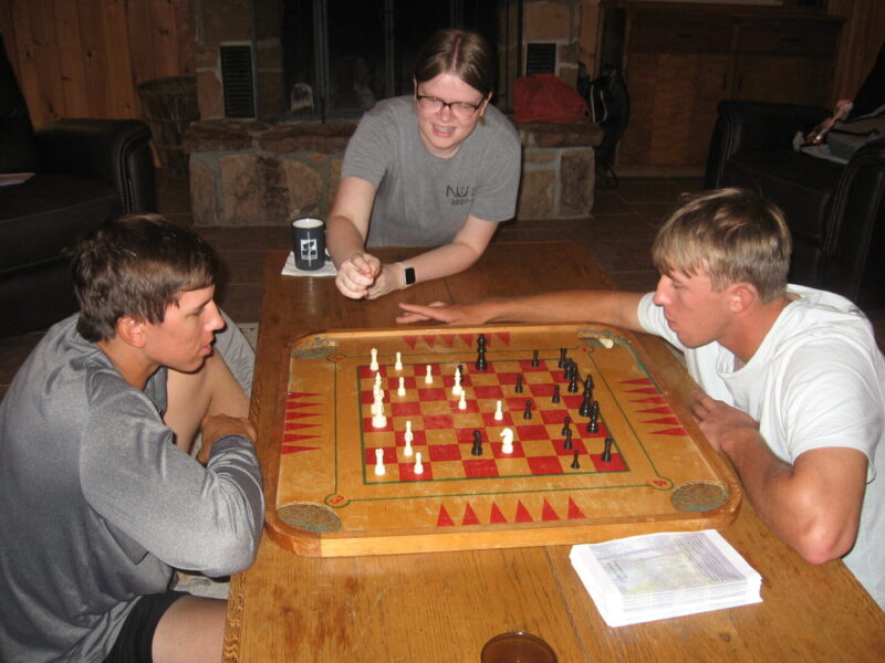 Students play a game of Chess.