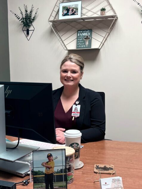 Pictures Tate sat down at office desk