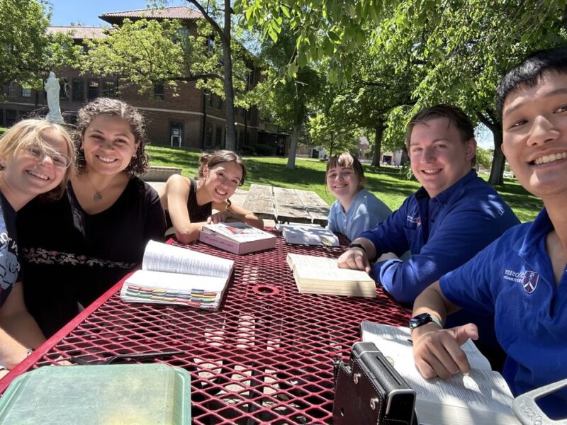 Students gather for a Bible study outside Sacred Heart Hall.