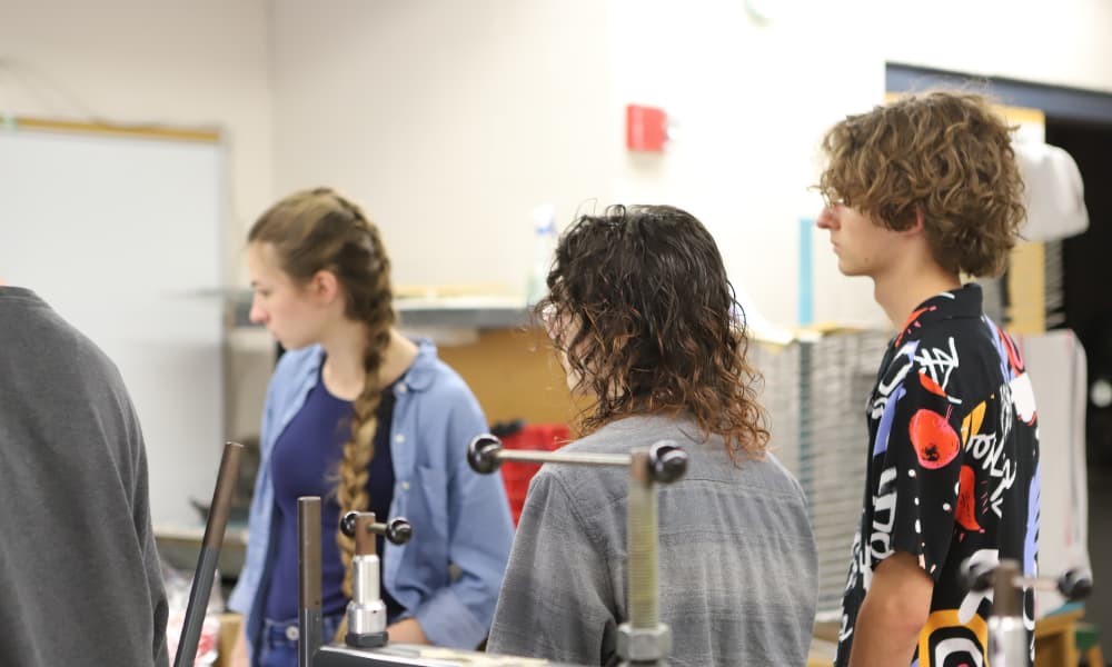 Newman University Art Students listening to instructions in class