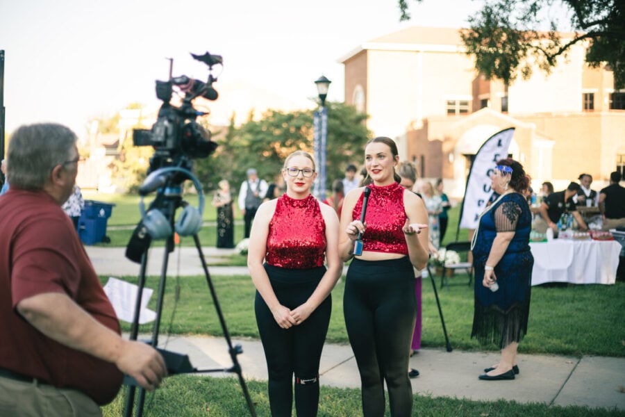 Pictures Mayer and another dancer being interviewed at Party on the Plaza
