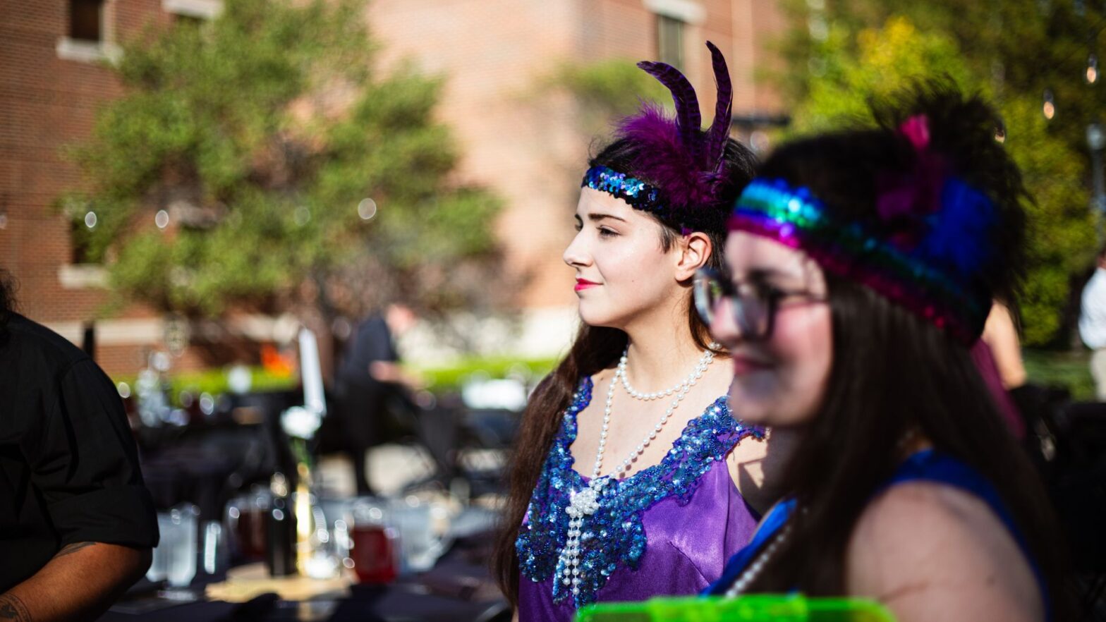 The Newman chorale and troubadours dressed in 1920's style costumes while volunteering at Party on the Plaza.